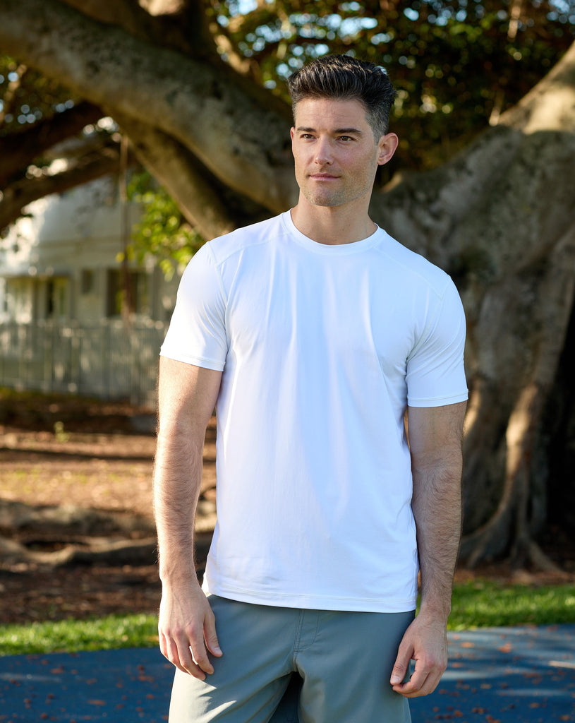 Man standing outside wearing short sleeve crew shirt in white. (Style 11002) - BloqUV