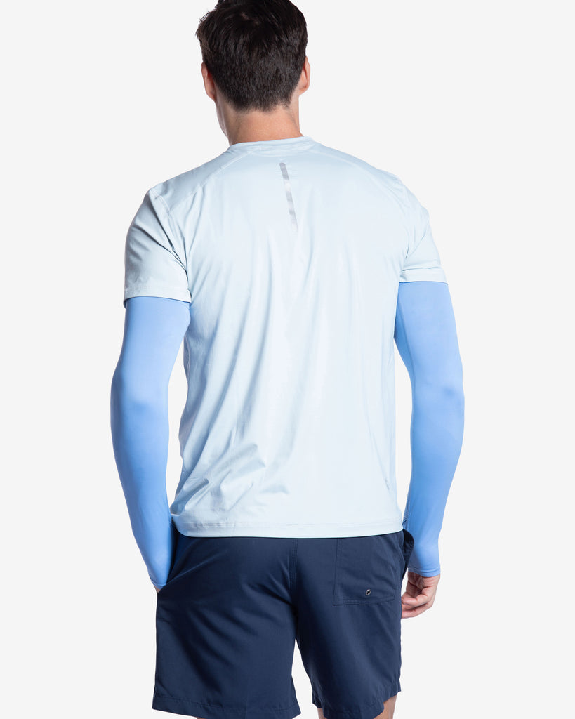 Man wearing indigo color unisex sleeves with short sleeve soft grey crew shirt. Back of sleeves and shirt shown. (Style 5005) - BloqUV