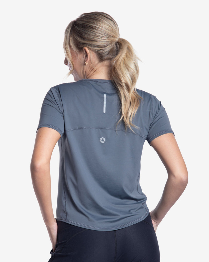 Women wearing smoke short sleeve crew top with black joggers tights. Picture shows reflector in the back of the shirt. (Style 1101) - BloqUV