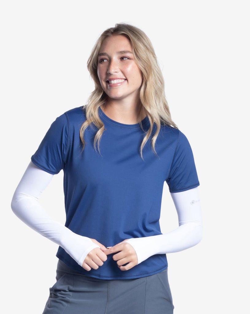 Women wearing navy short sleeve crew top with white sun sleeves and smoke joggers tights. (Style 1101) - BloqUV
