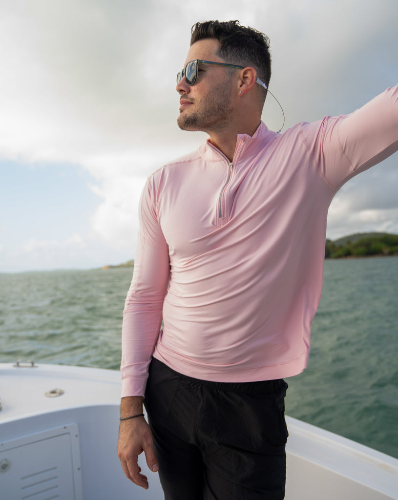 Man on boat wearing long sleeve mock zip shirt in tickle me pink. (Style 12001) - BloqUV