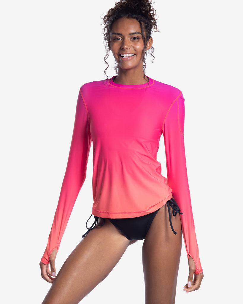 Women wearing printed ombre flowers of the sun long sleeve 24/7 shirt with black swimsuit bottom. (Style 2001J) - BloqUV