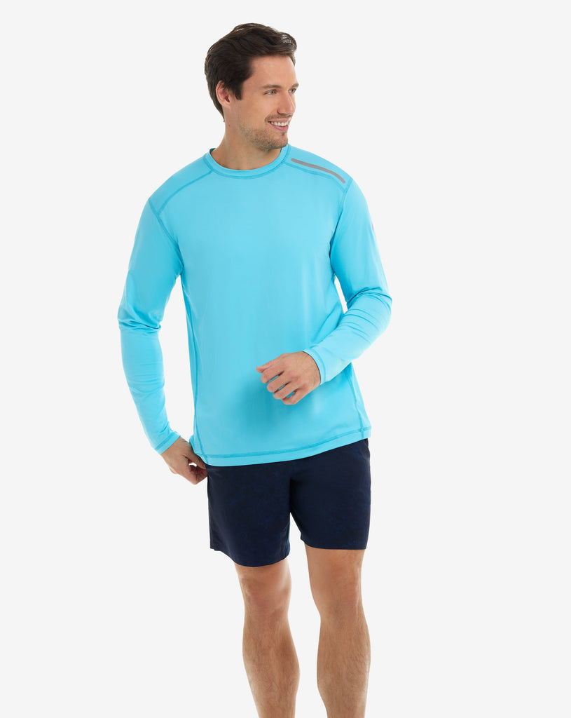 Man wearing long sleeve jet tee shirt in light turquoise. (Style 12002) - BloqUV