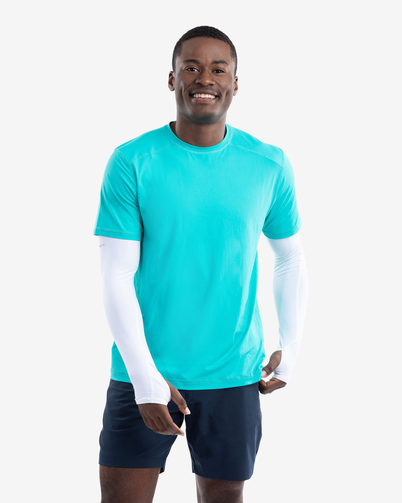 Man wearing short sleeve crew shirt in caribbean blue with sun protective sleeves in white. (Style 11002) - BloqUV