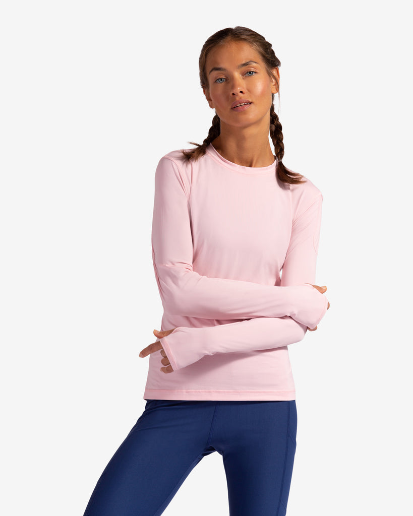 Women wearing tickle me pink long sleeve 24/7 shirt with navy leggings. (Style 2001) - BloqUV