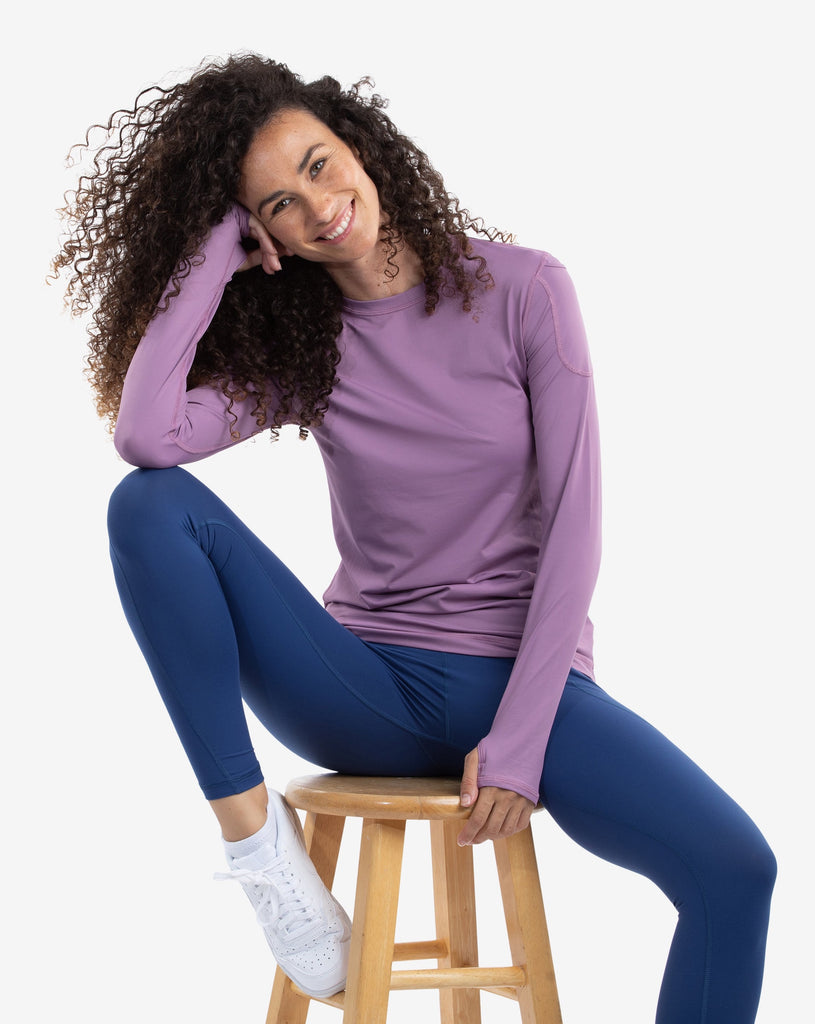 Women wearing plum long sleeve 24/7 shirt with navy tights. (Style 2001) - BloqUV