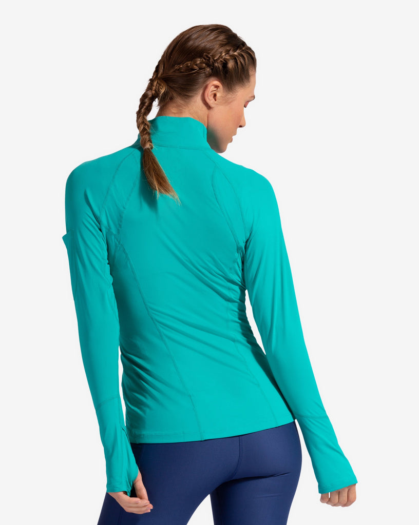 Women wearing caribbean blue mock zip long sleeve top with navy tights. Picture shows the back of the shirt. (Style 3001) - BloqUV