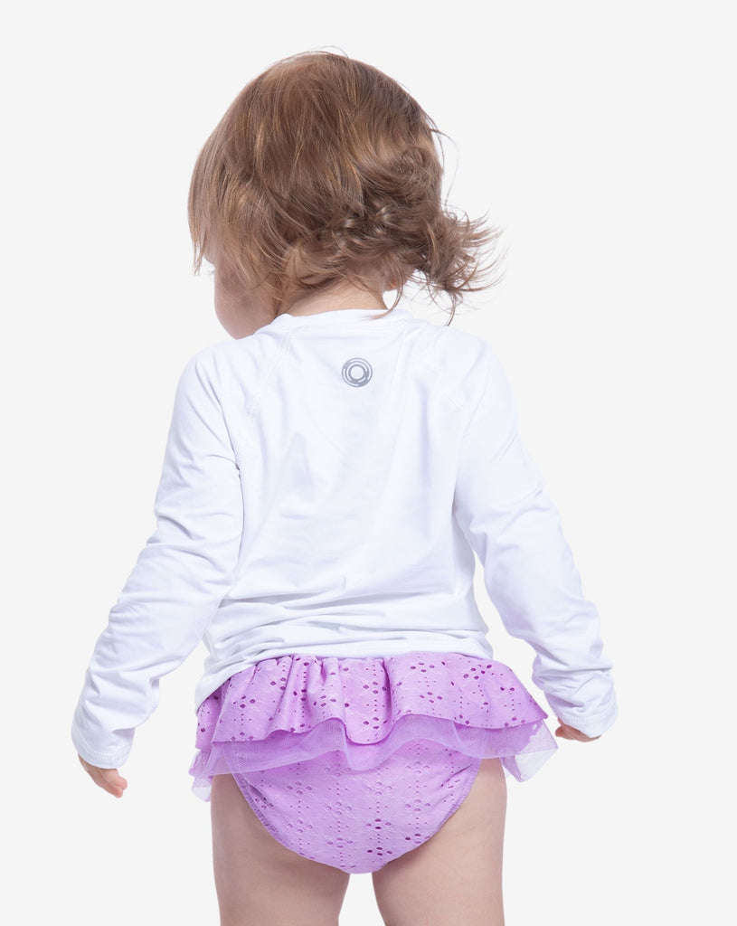 Toddler girl wearing white crew neck top. Back of shirt shown in picture.(Style 1005T) - BloqUV