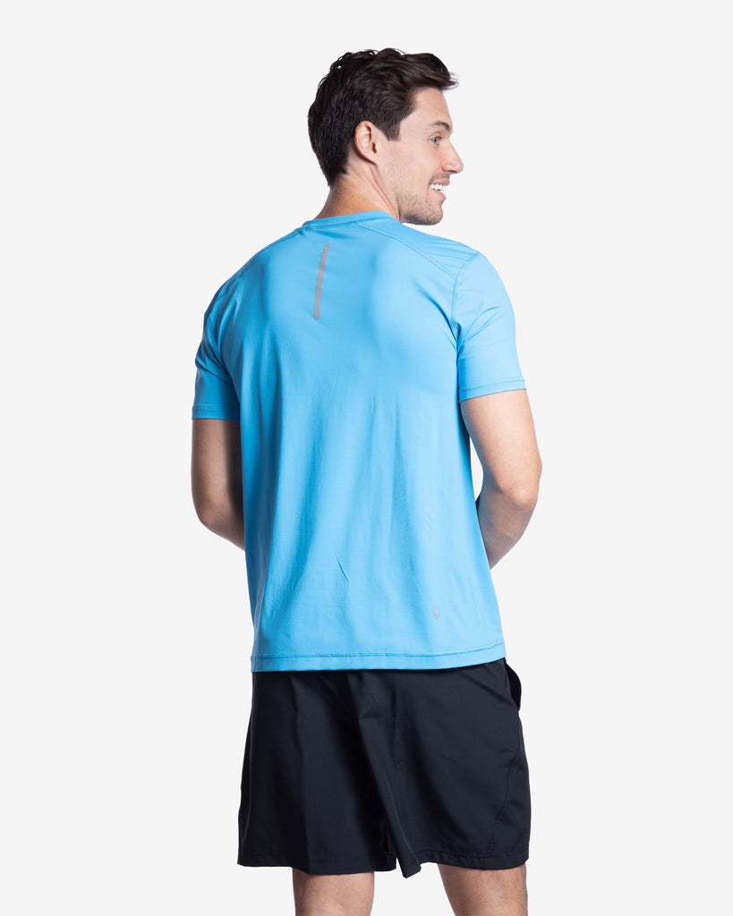 Man wearing short sleeve crew shirt in ocean blue. Picture shows back of shirt with reflective top. (Style 11002) - BloqUV