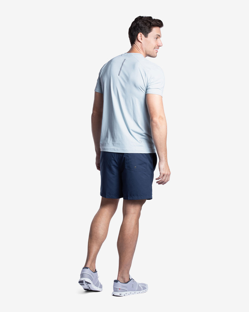 Man wearing short sleeve crew shirt in soft grey. Picture shows back of shirt with reflective top. (Style 11002) - BloqUV