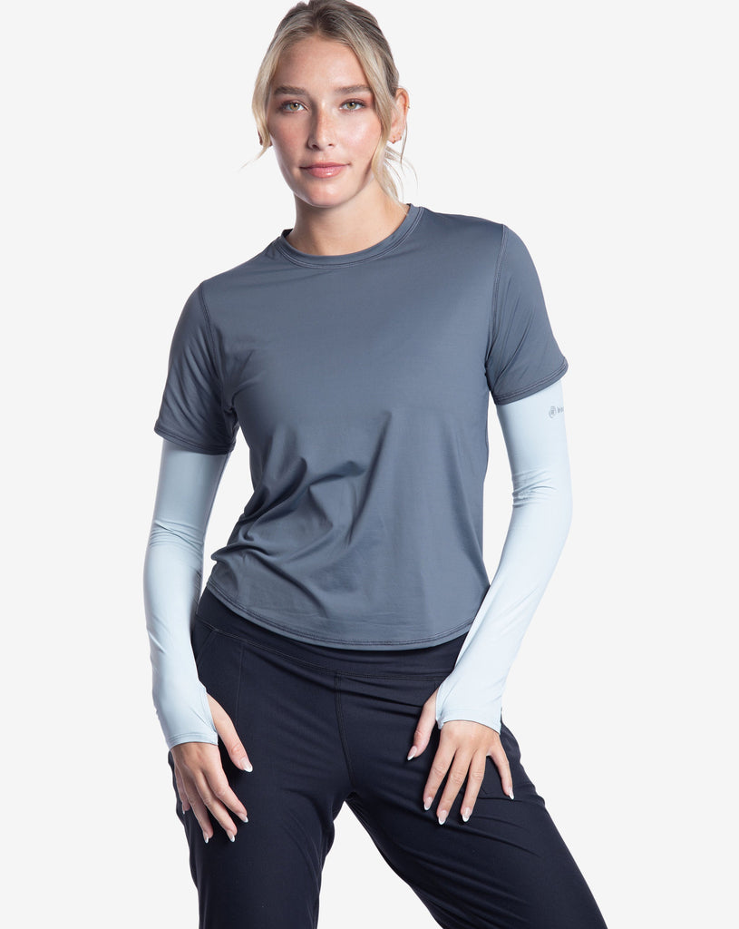 Women wearing smoke short sleeve crew top with soft grey sun sleeves and black joggers tights.  (Style 1101) - BloqUV