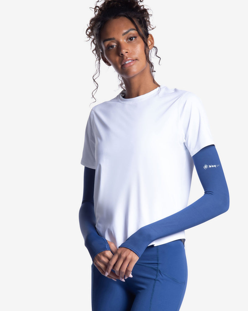 Women wearing white short sleeve crew top with navy sun sleeves and navy tights. (Style 1101) - BloqUV