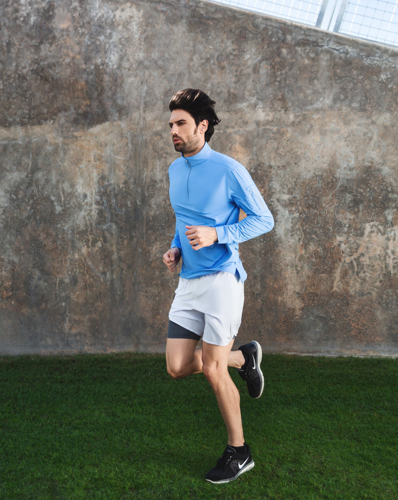 Man running outdoors wearing long sleeve mock zip shirt in indigo. (Style 12001) - BloqUV