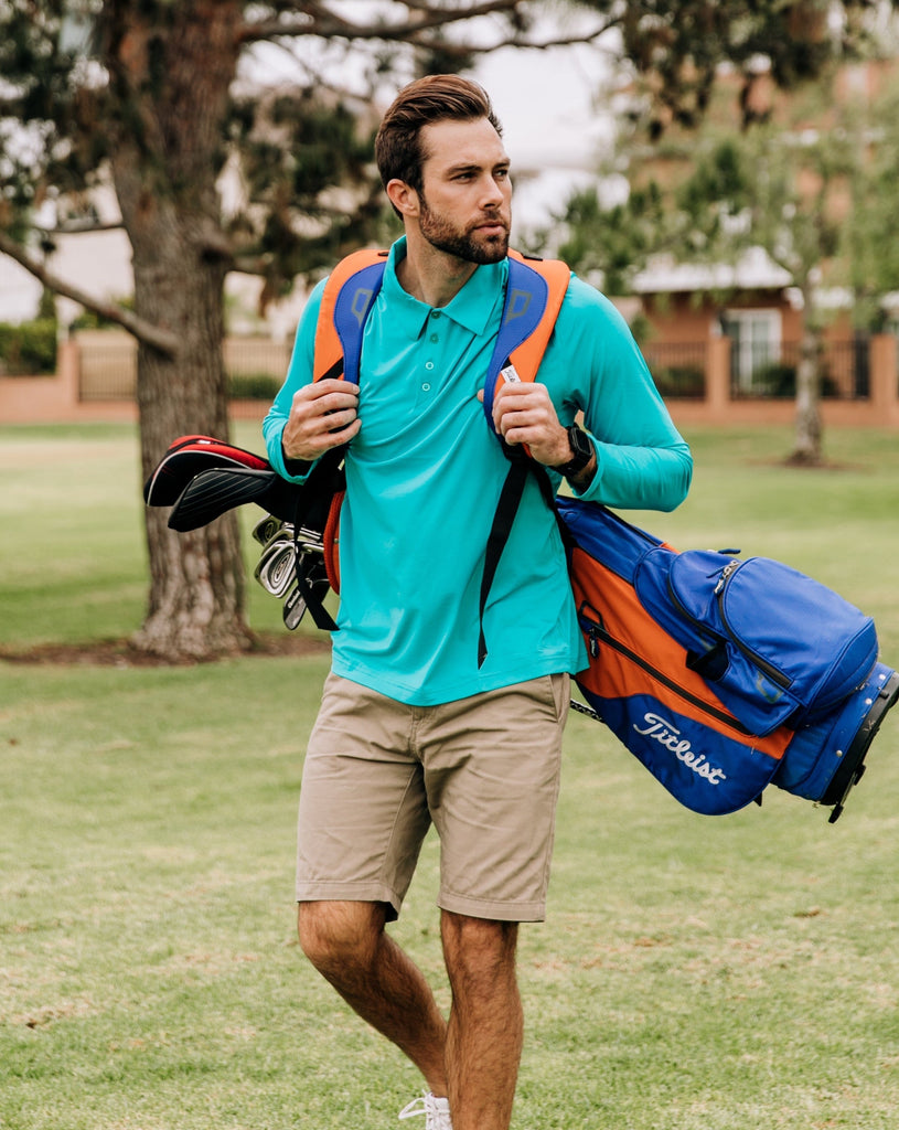 Man wearing long sleeve collared shirt in caribbean blue at the golf course. (Style 12004) - BloqUV