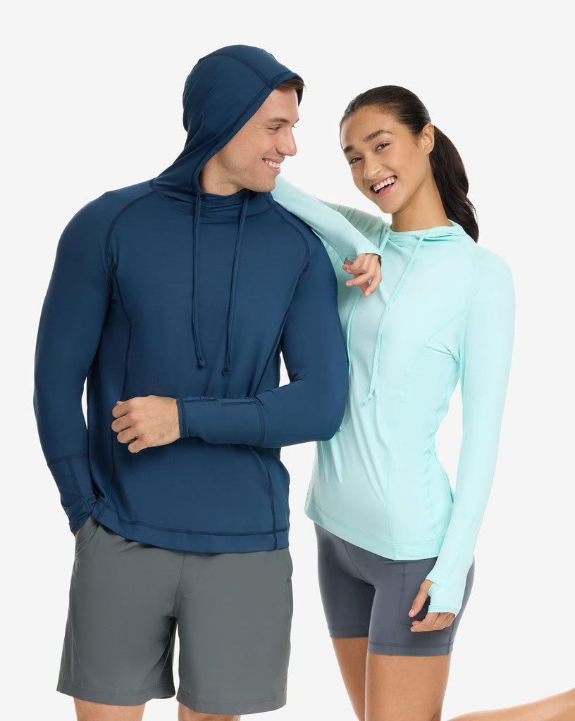 Two people wearing athletic clothing on a white background