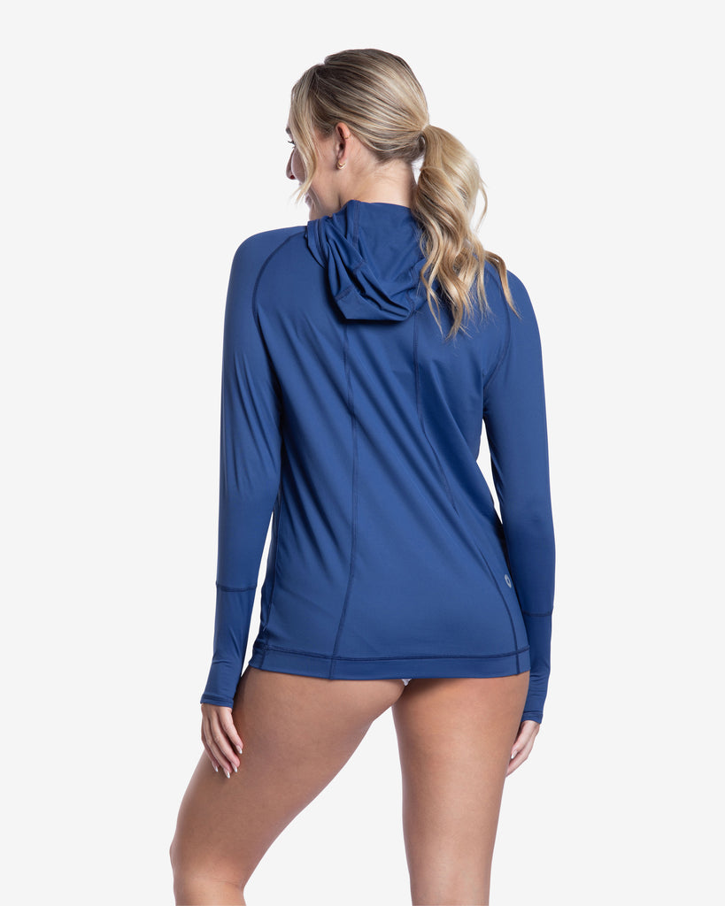 Women wearing navy color unisex long sleeve hoodie shirt. Back shown in picture. (Style 12007) - BloqUV