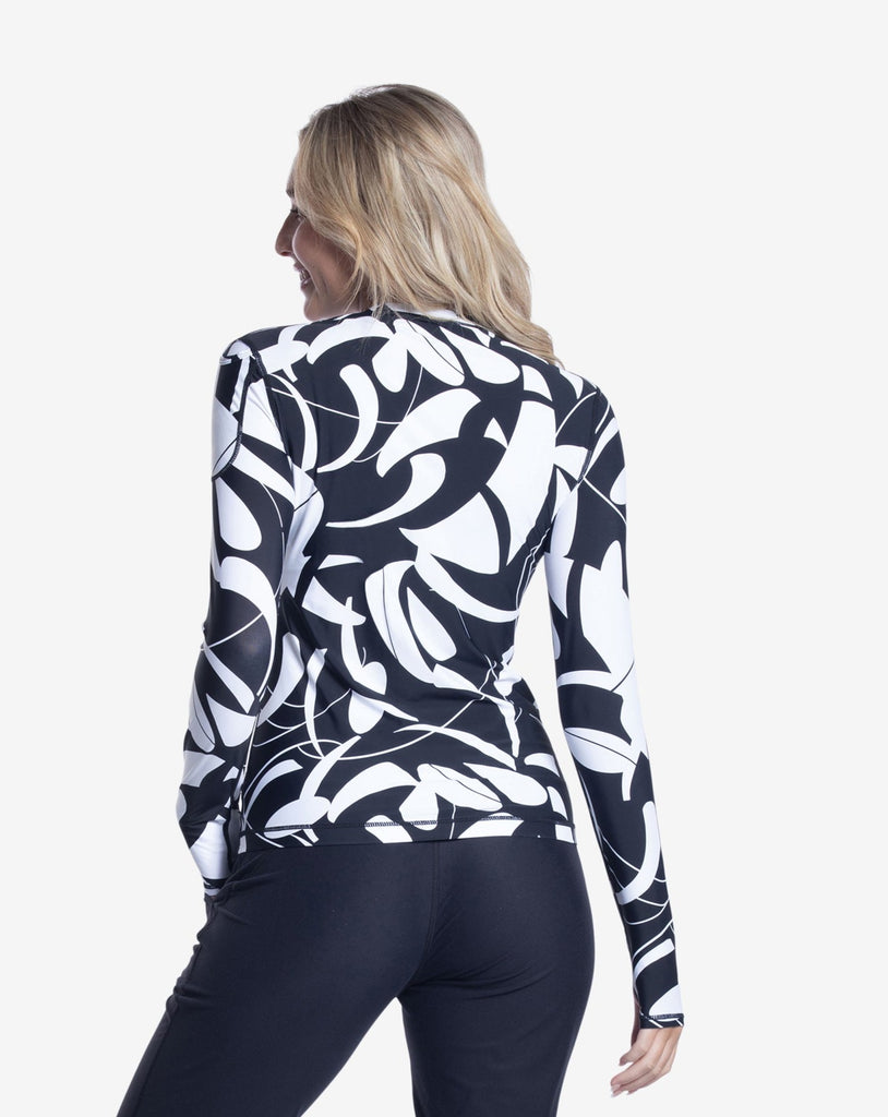 Women wearing printed black and white long sleeve 24/7 shirt with black joggers. Picture shows back of shirt. (Style 2001J) - BloqUV