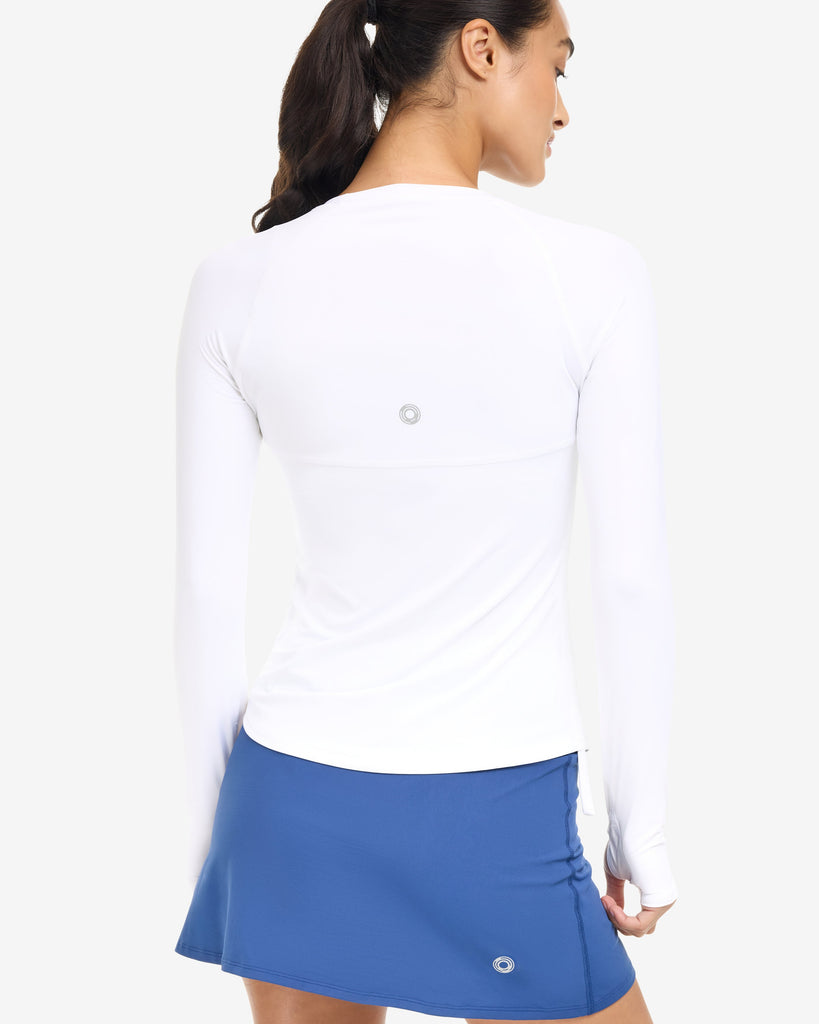 Women wearing drawstring top in white with  navy skort - back shown. (Style 6100) - BloqUV