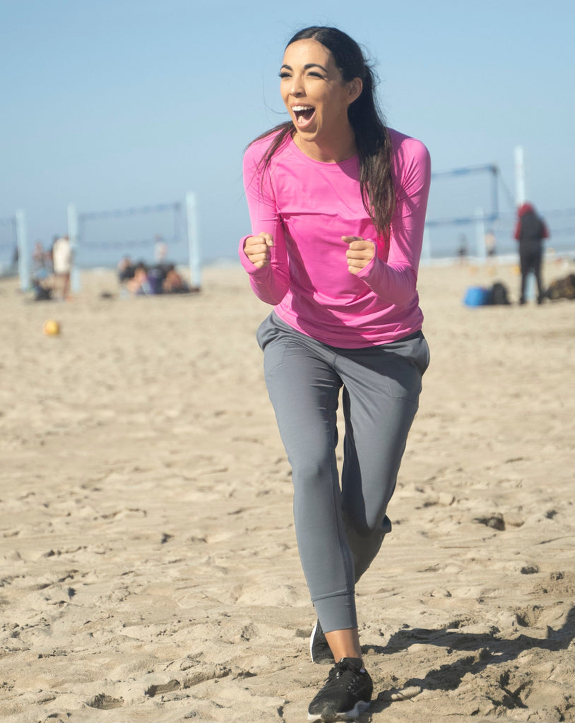 Women at the beach wearing bubble gum long sleeve pullover shirt. (Style 2012) - BloqUV