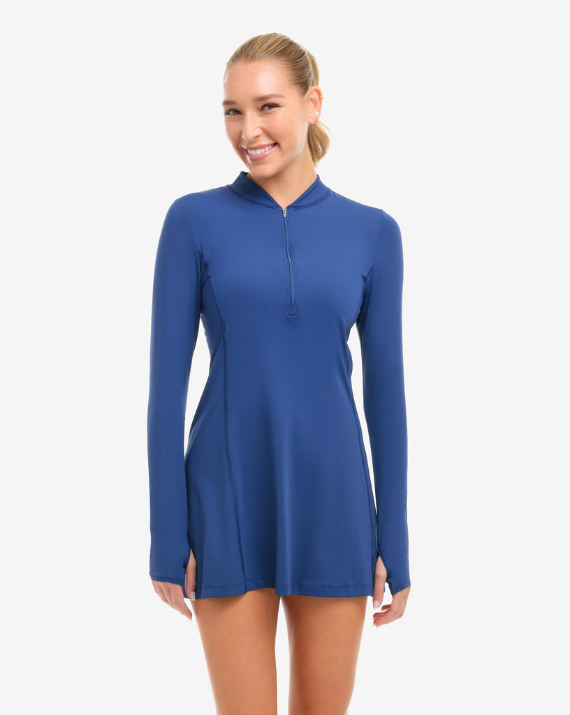 Woman wearing a blue dress on a white background