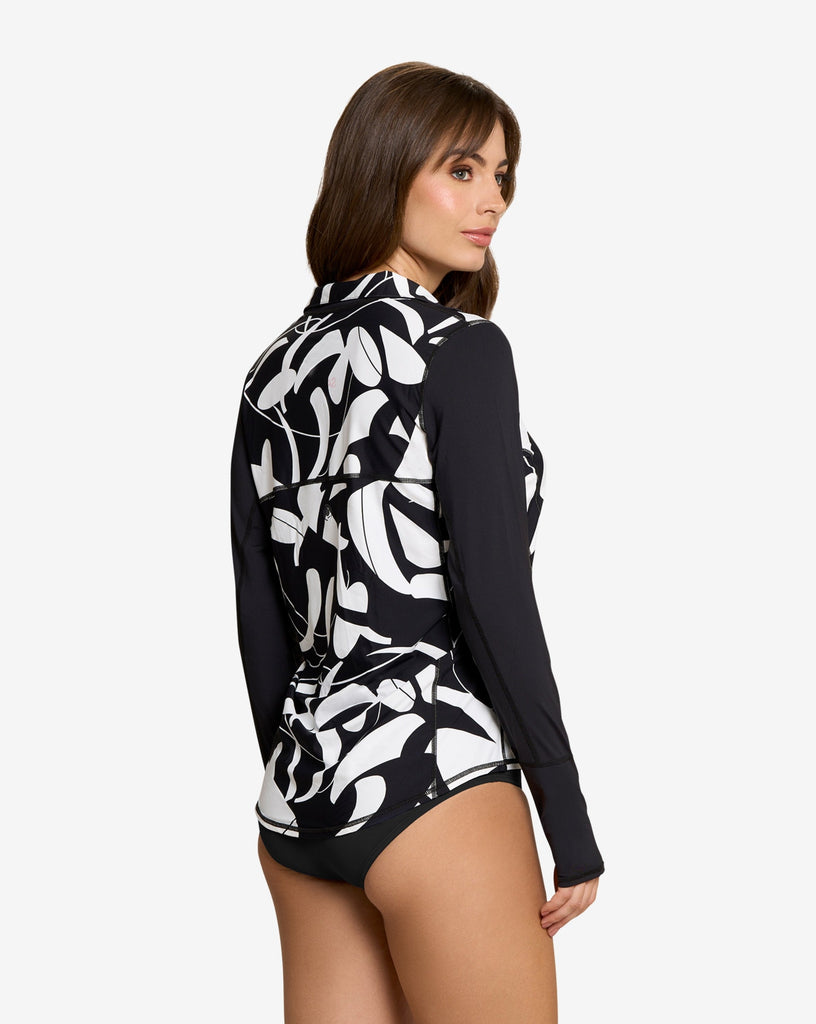 Women wearing printed black and white long sleeve relaxed mock zip with white black swimsuit. (Style 3002J) - BloqUV