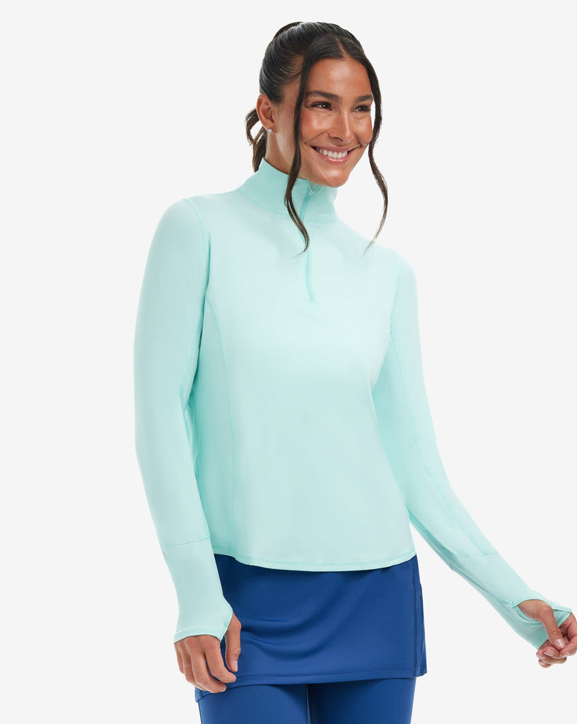Women wearing mint relaxed mock zip top with navy capri tights. (Style 3002) - BloqUV