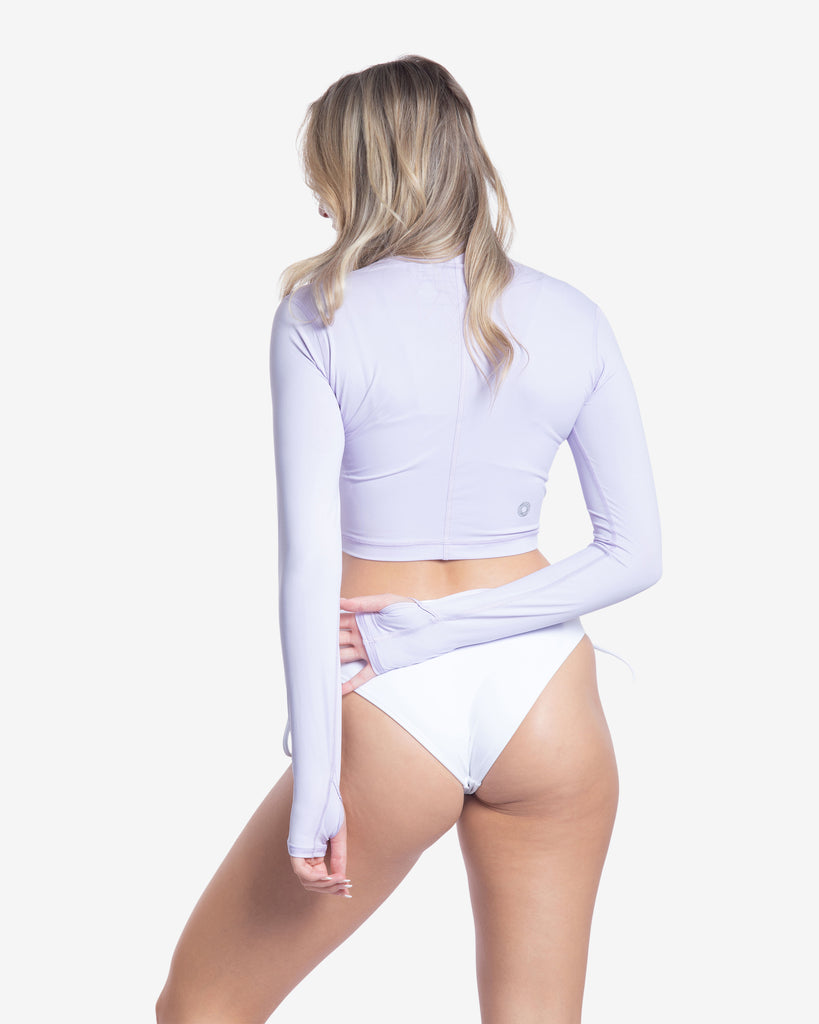 Women wearing lavender everyday crop top with bikini swimsuit. Back of shirt shown in picture. (Style 4015) - BloqUV