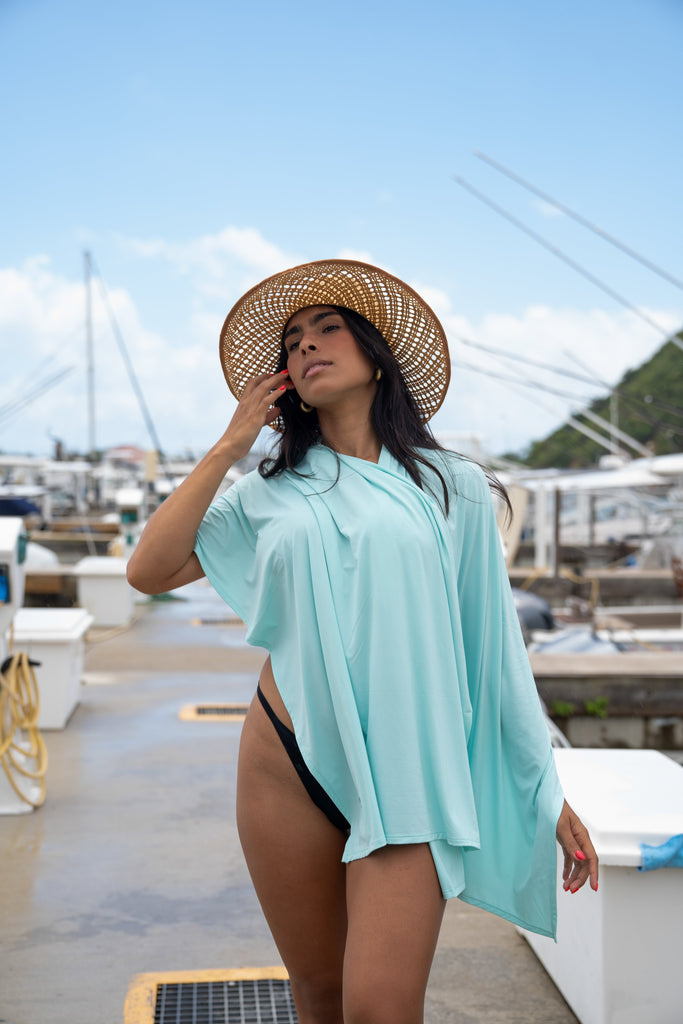 Women at the marina wearing mint blanket wrap around her shoulders (Style 5000) - BloqUV