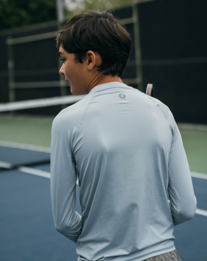 Boy at tennis court wearing soft grey color top.  (Style 1005K) - BloqUV