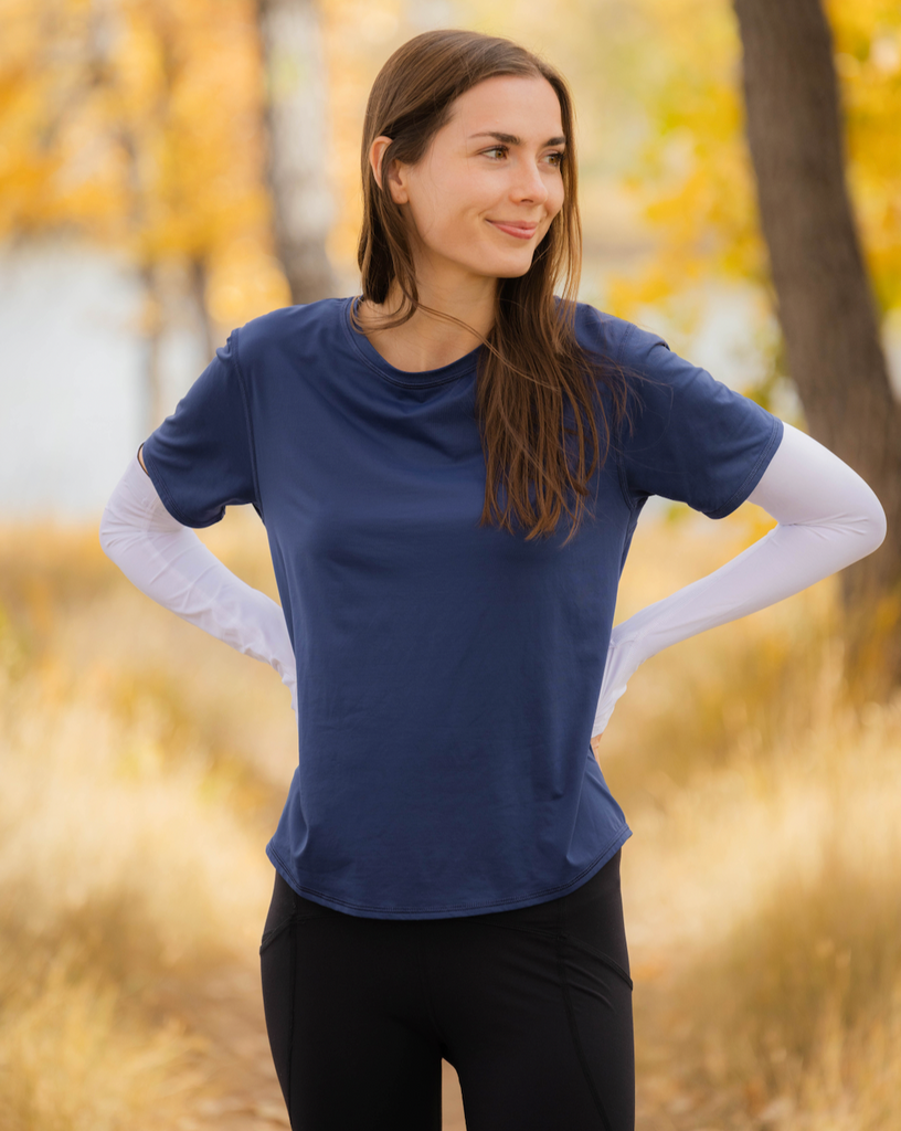 Women wearing navy short sleeve crew top with and smoke tights. Picture shows back of shirt with reflective. (Style 1101) - BloqUV