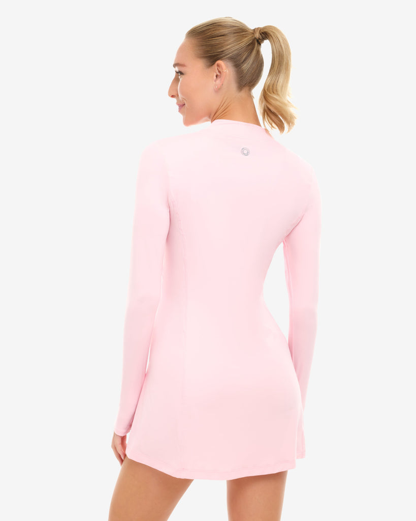 Woman wearing a pink dress on a white background