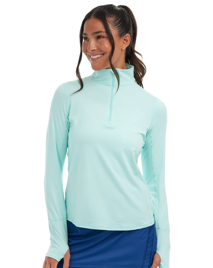 Women wearing mint relaxed mock zip top with navy capri tights. (Style 3002) - BloqUV