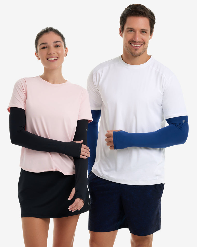 Women wearing tickle me pink short sleeve crew top with black sun sleeves and black skirt with man wearing mens crew neck with sleeves in navy. (Style 1101) - BloqUV