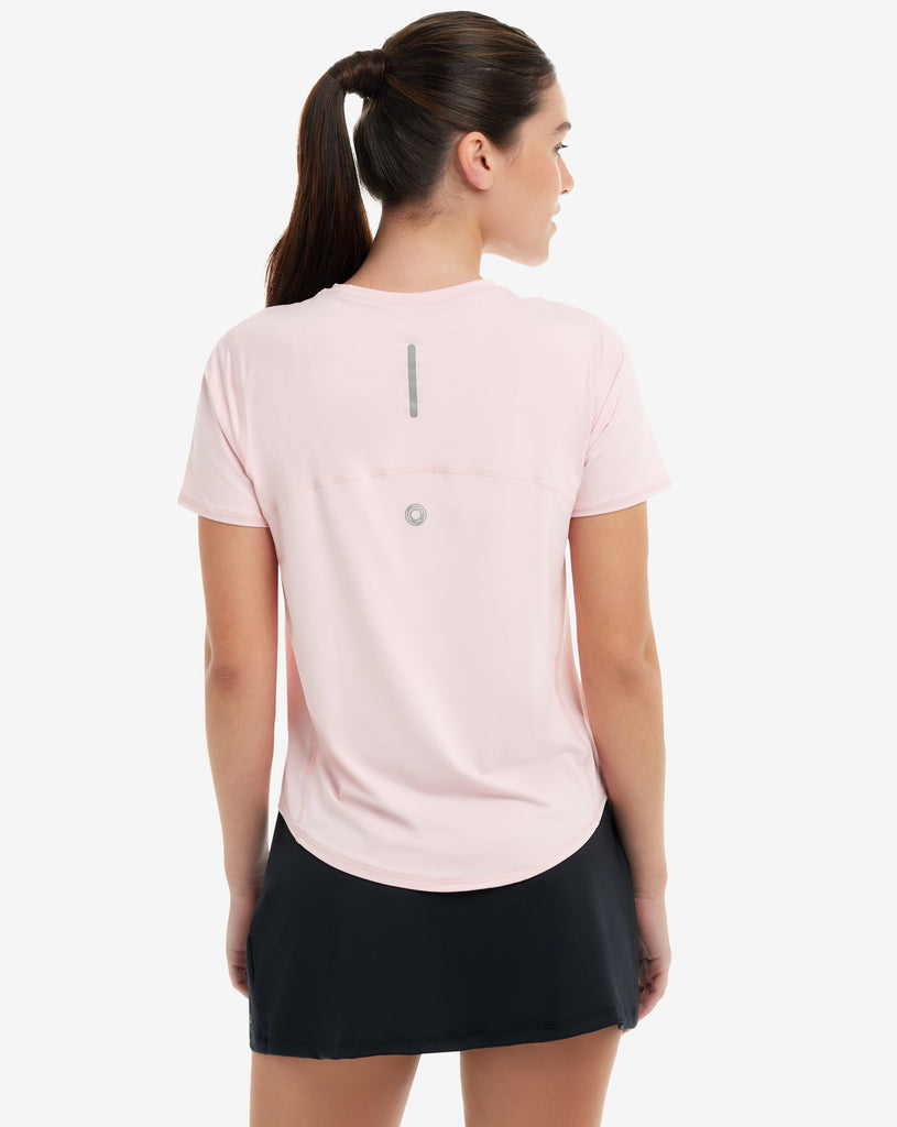 Women wearing tickle me pink short sleeve crew top with and black skirt. Picture shows back of shirt with reflector. (Style 1101) - BloqUV