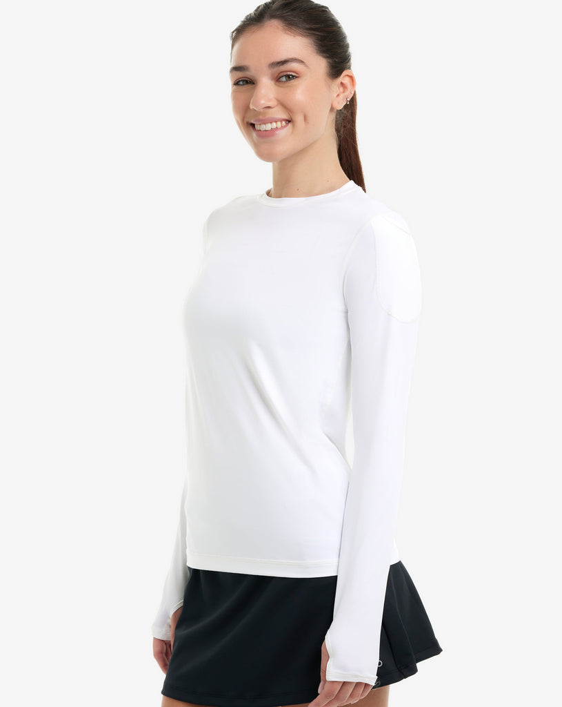 Women wearing white long sleeve 24/7 shirt with black skort. (Style 2001) - BloqUV