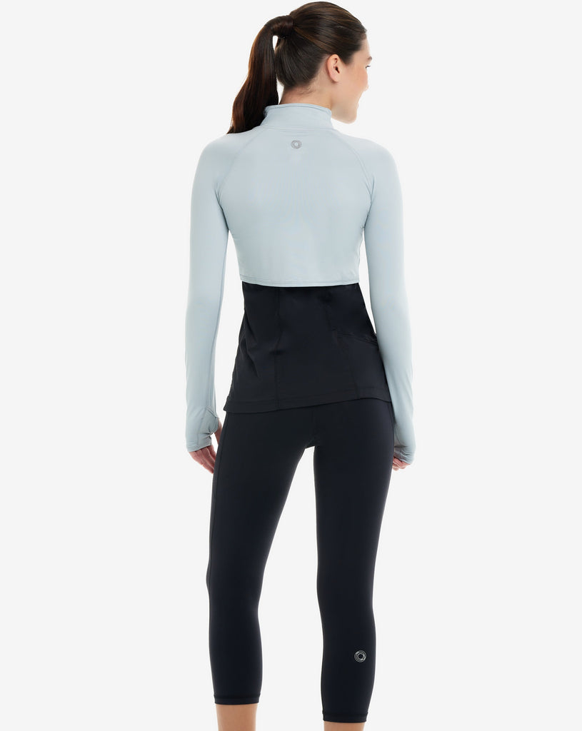 Women wearing soft grey full zip crop top over tank top. Picture shows back of model. (Style 4010) - BloqUV