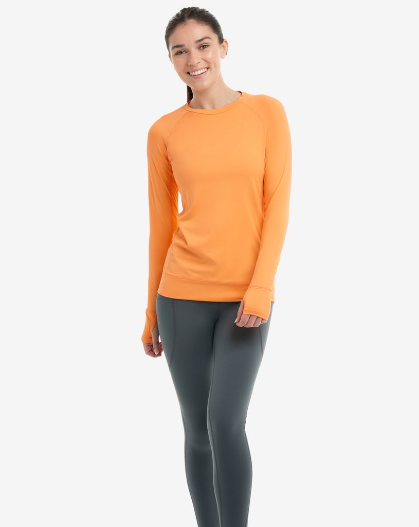 Women wearing tangerine long sleeve pullover shirt. (Style 2012) - BloqUV