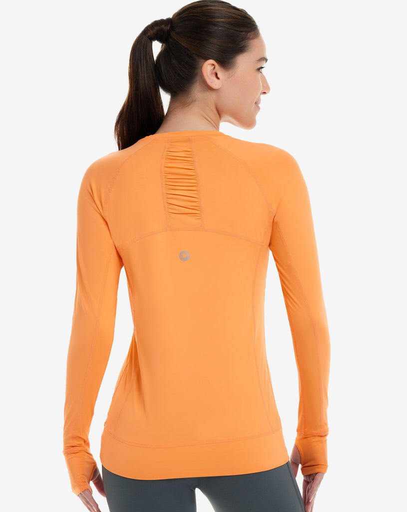 Women wearing tangerine long sleeve pullover shirt. Back of shirt shown in picture. (Style 2012) - BloqUV