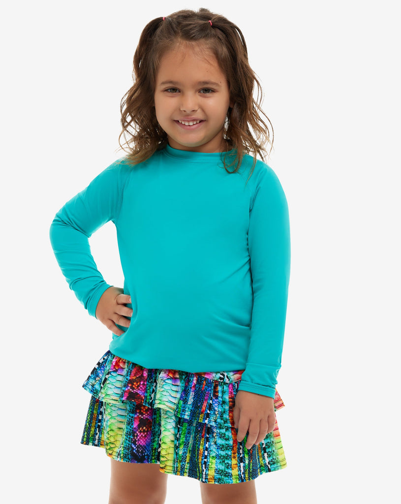 Girl wearing caribbean blue color top with a colorful skirt. (Style 1005K) - BloqUV