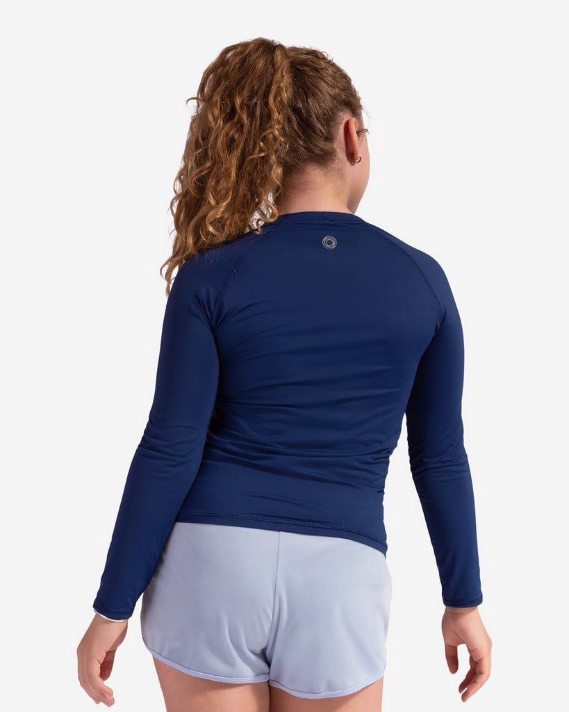 Girl wearing navy color top with exercise shorts. Showing the back. (Style 1005K) - BloqUV