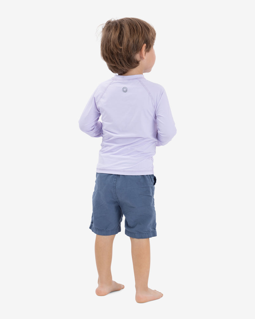 Toddler wearing lavender crew neck top. Back of shirt shown in picture. (Style 1005T) - BloqUV