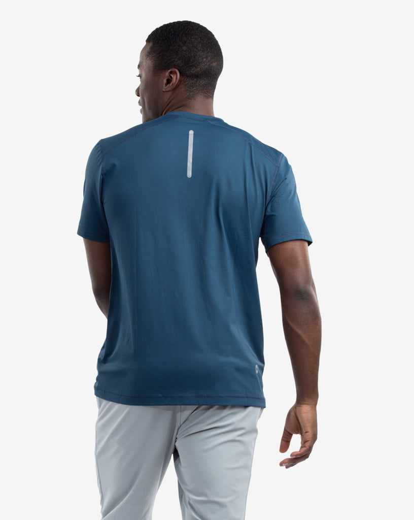 Man wearing short sleeve crew shirt in midnight blue. Picture shows back of shirt with reflective top. (Style 11002) - BloqUV
