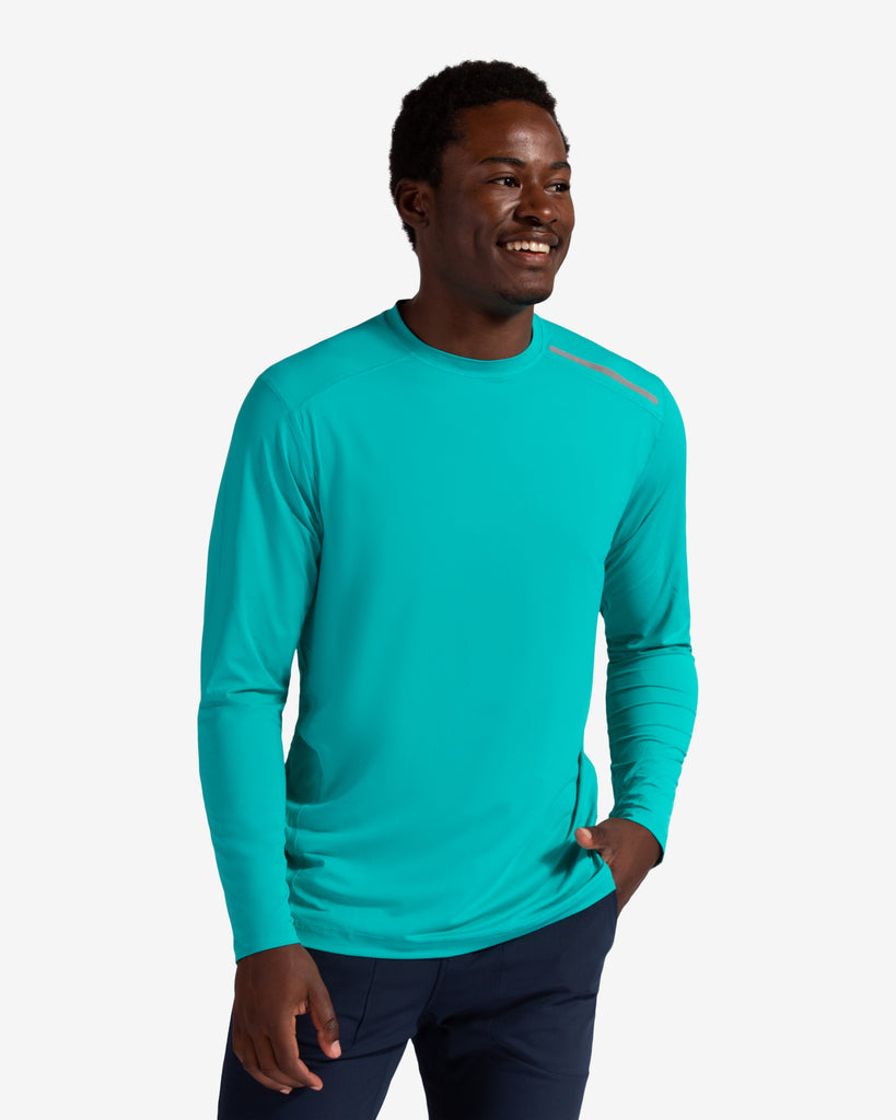 Man wearing long sleeve jet tee shirt in caribbean blue. (Style 12002) - BloqUV