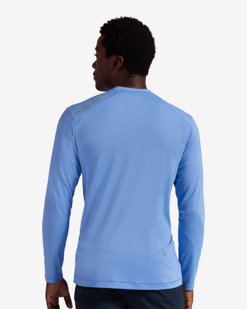 Man wearing long sleeve jet tee shirt in indigo - back view showing. (Style 12002) - BloqUV