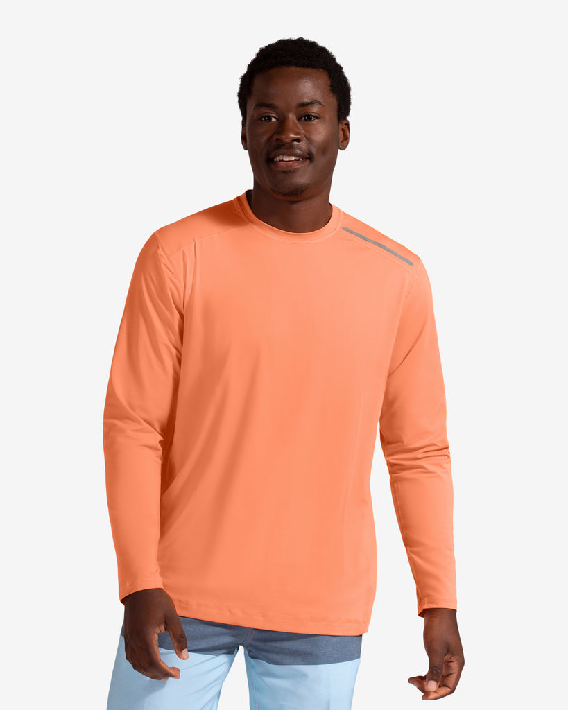 Man wearing long sleeve jet tee shirt in tangerine. (Style 12002) - BloqUV