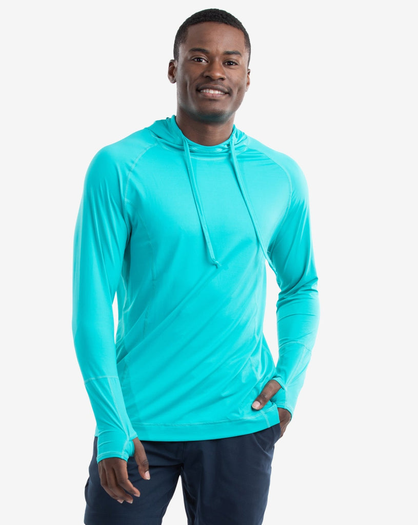 Man wearing caribbean blue color unisex long sleeve hoodie shirt. (Style 12007) - BloqUV