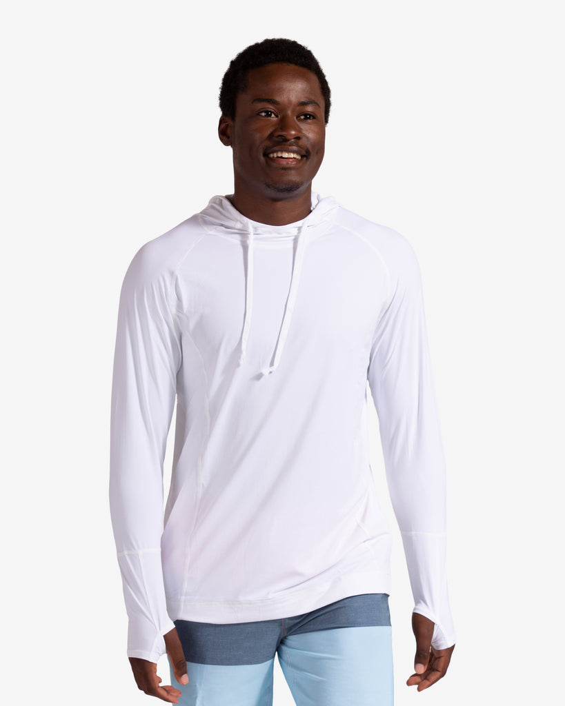 Man wearing white unisex long sleeve hoodie shirt.  (Style 12007) - BloqUV