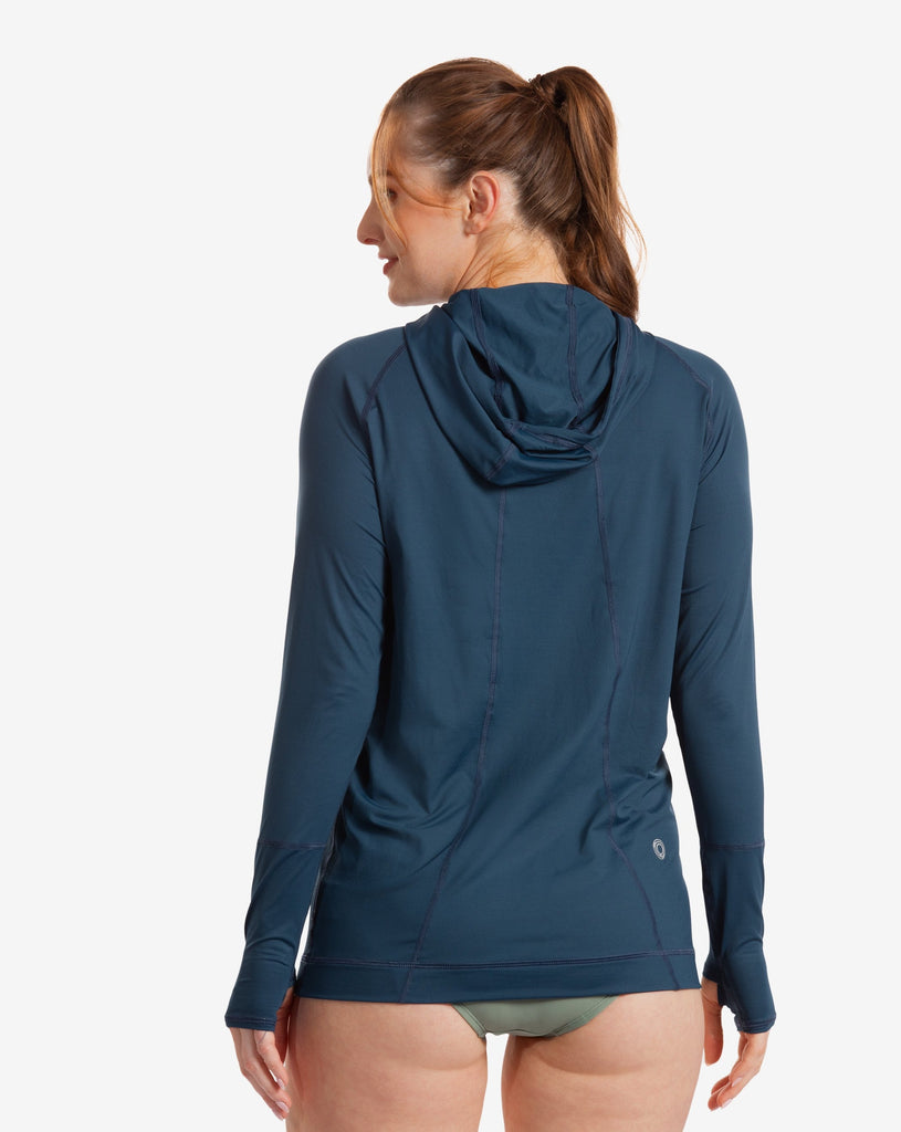 Women wearing midnight blue color unisex long sleeve hoodie shirt. Picture shows back of shirt. (Style 12007) - BloqUV