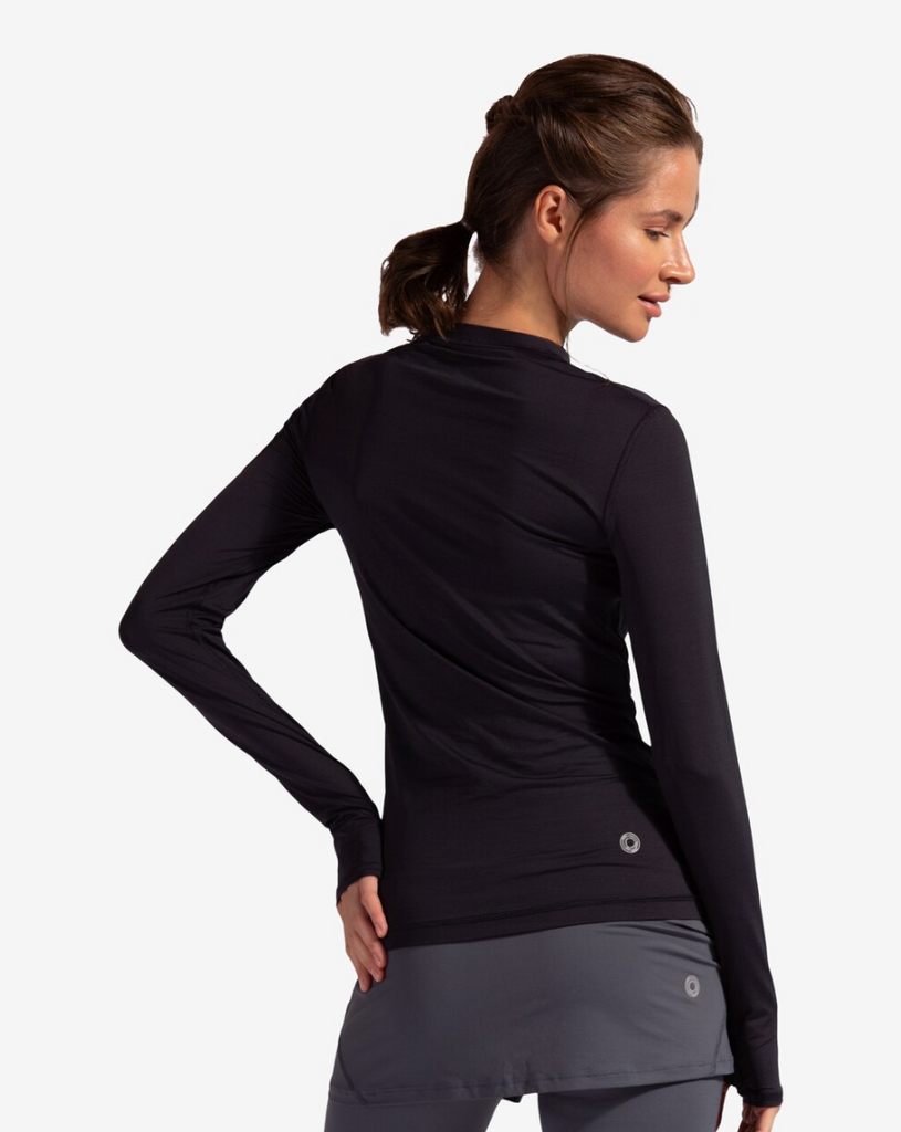 Women wearing black long sleeve 24/7 shirt with smoke capri skorts. Picture shows back of image. (Style 2001) - BloqUV