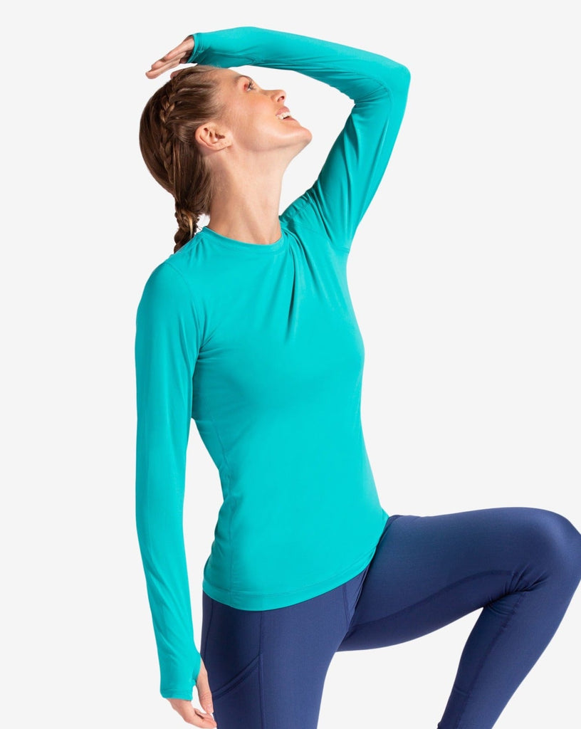 Women wearing caribbean blue long sleeve 24/7 shirt with navy tights. (Style 2001) - BloqUV